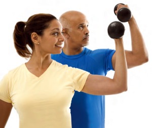 Two people using dumbbells