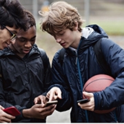 Young people looking at cell phones